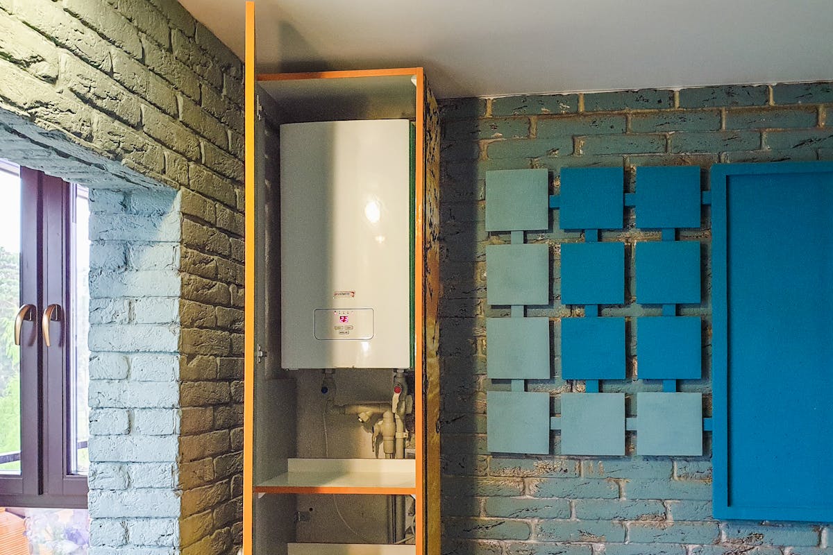 Modern combi boiler professionally wall-mounted in a Stockport home